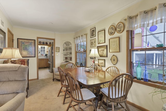 1470 Berkshire Rd, Columbus, OH 43221 - dining room with light colored carpet, crown molding, and baseboards