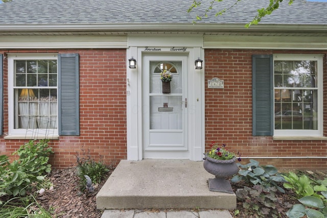 1470 Berkshire Rd, Columbus, OH 43221 - property entrance featuring a shingled roof and brick siding