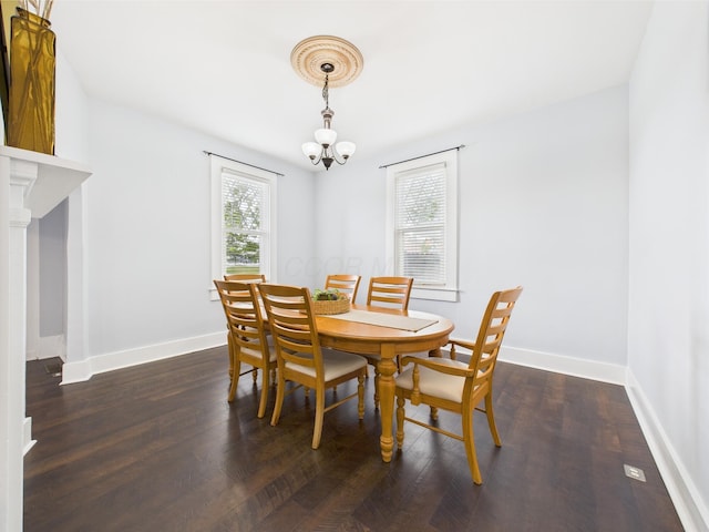 715 N Broad St, Lancaster, OH 43130 - dining area featuring a chandelier, wood finished floors, and baseboards