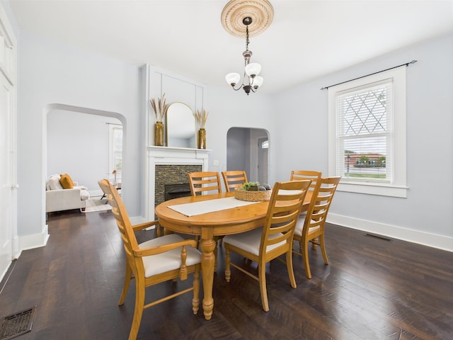 715 N Broad St, Lancaster, OH 43130 - dining space featuring arched walkways, a stone fireplace, plenty of natural light, and baseboards