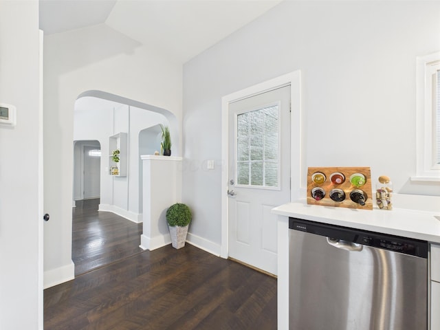 715 N Broad St, Lancaster, OH 43130 - doorway with arched walkways, dark wood finished floors, vaulted ceiling, and baseboards