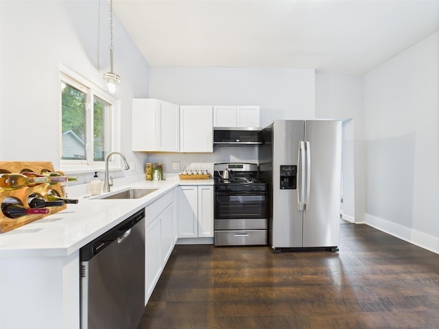 715 N Broad St, Lancaster, OH 43130 - kitchen with stainless steel appliances, a sink, light countertops, and dark wood-style flooring