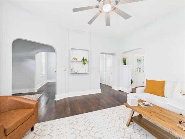 715 N Broad St, Lancaster, OH 43130 - living room featuring arched walkways, hardwood / wood-style flooring, ceiling fan, and baseboards