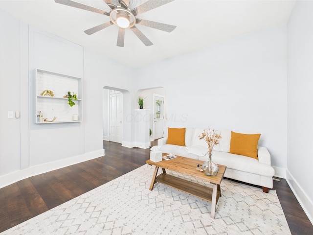 715 N Broad St, Lancaster, OH 43130 - living area with arched walkways, a ceiling fan, baseboards, and wood finished floors