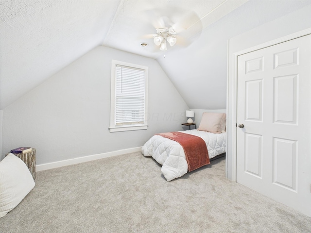 715 N Broad St, Lancaster, OH 43130 - bedroom with carpet floors, lofted ceiling, baseboards, and a ceiling fan