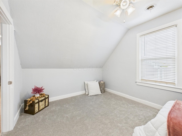 715 N Broad St, Lancaster, OH 43130 - living area with vaulted ceiling, ceiling fan, carpet, and baseboards