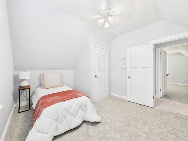 715 N Broad St, Lancaster, OH 43130 - carpeted bedroom featuring vaulted ceiling, baseboards, and a ceiling fan