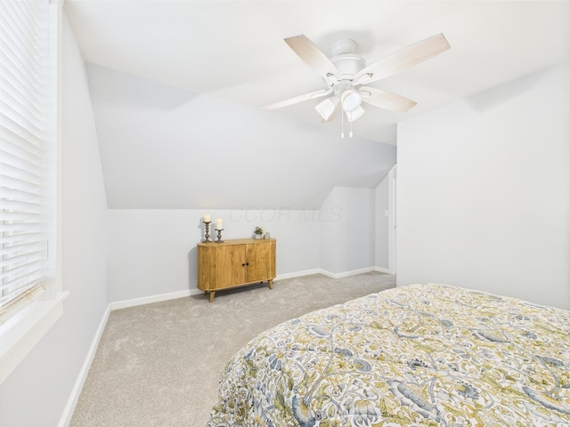 715 N Broad St, Lancaster, OH 43130 - carpeted bedroom with vaulted ceiling, baseboards, and ceiling fan
