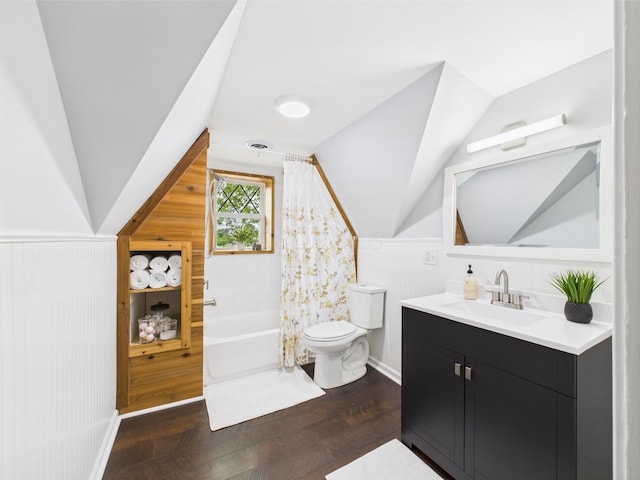 715 N Broad St, Lancaster, OH 43130 - full bathroom with toilet, vanity, wood finished floors, lofted ceiling, and wainscoting