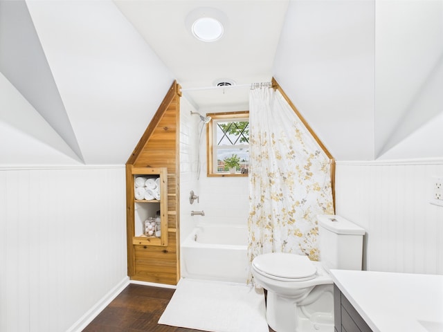 715 N Broad St, Lancaster, OH 43130 - full bath with wood finished floors, vanity, toilet, shower / tub combo, and vaulted ceiling