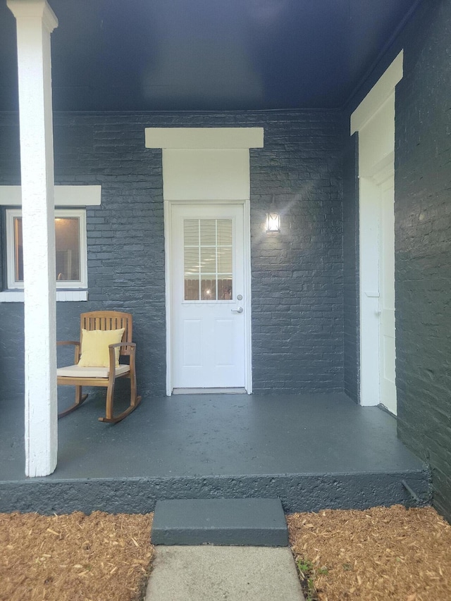 715 N Broad St, Lancaster, OH 43130 - property entrance featuring brick siding