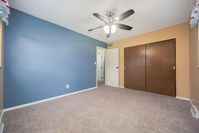 13789 Cobblestone Ln, Pickerington, OH 43147 - unfurnished bedroom featuring carpet floors, a closet, baseboards, and a ceiling fan