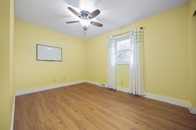 13789 Cobblestone Ln, Pickerington, OH 43147 - unfurnished room with light wood-style flooring, ceiling fan, and baseboards