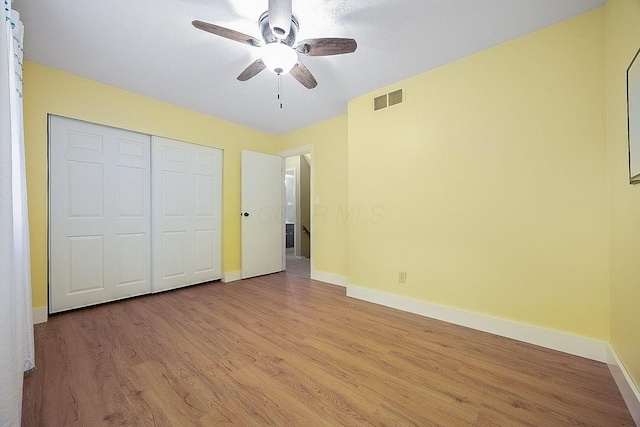 13789 Cobblestone Ln, Pickerington, OH 43147 - unfurnished bedroom with baseboards, light wood-type flooring, a closet, and a ceiling fan