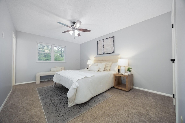 13789 Cobblestone Ln, Pickerington, OH 43147 - bedroom with carpet flooring, baseboards, a ceiling fan, and a textured ceiling