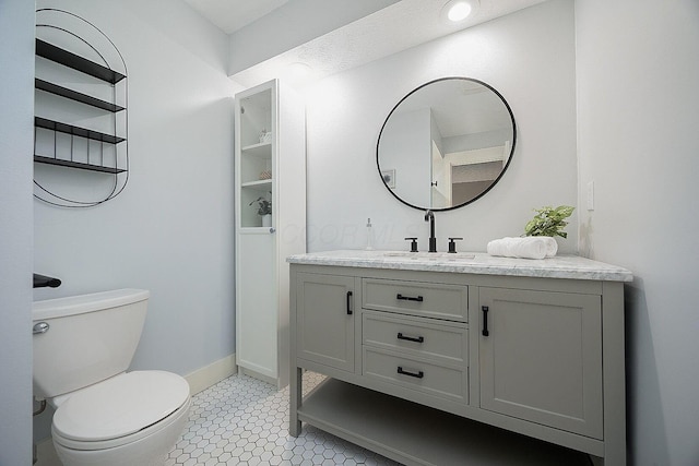 13789 Cobblestone Ln, Pickerington, OH 43147 - bathroom with toilet, vanity, and baseboards
