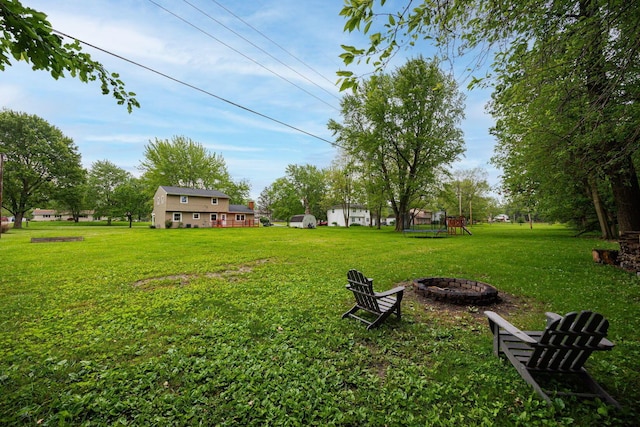 13789 Cobblestone Ln, Pickerington, OH 43147 - view of grassy yard featuring a fire pit