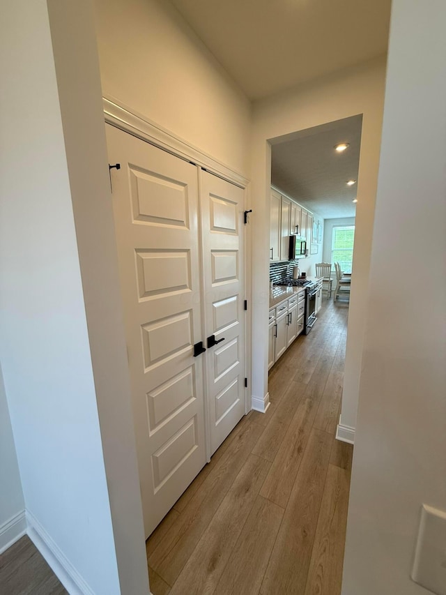 2497 Nelson Ln, Delaware, OH 43015 - corridor with light wood-style flooring, baseboards, and recessed lighting