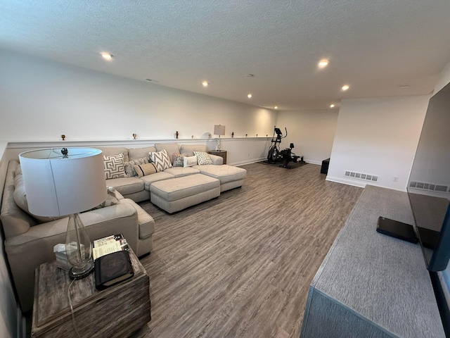 2497 Nelson Ln, Delaware, OH 43015 - living area with wood finished floors, recessed lighting, a textured ceiling, and baseboards