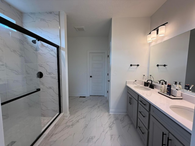 2497 Nelson Ln, Delaware, OH 43015 - full bathroom with marble finish flooring, double vanity, baseboards, and a marble finish shower
