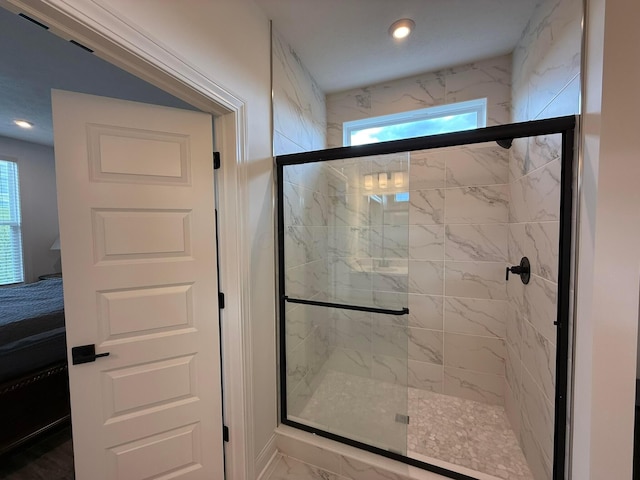 2497 Nelson Ln, Delaware, OH 43015 - bathroom featuring healthy amount of natural light, marble finish flooring, a marble finish shower, and recessed lighting
