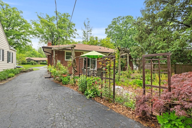 2629 Woodley Rd, Columbus, OH 43231 - view of front of house with brick siding and a chimney