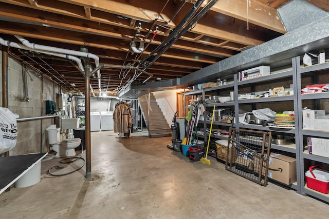 2629 Woodley Rd, Columbus, OH 43231 - unfinished basement featuring washer and clothes dryer and stairs