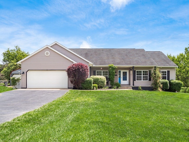 9148 Mccord Rd, Orient, OH 43146 - single story home with a front yard, driveway, a garage, and a shingled roof