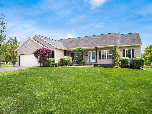 9148 Mccord Rd, Orient, OH 43146 - ranch-style home with driveway, a garage, a front yard, a shingled roof, and covered porch