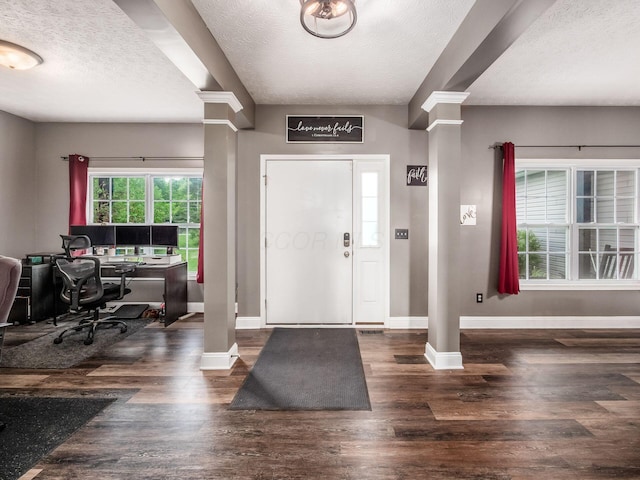 9148 Mccord Rd, Orient, OH 43146 - entrance foyer with decorative columns, baseboards, a textured ceiling, and wood finished floors