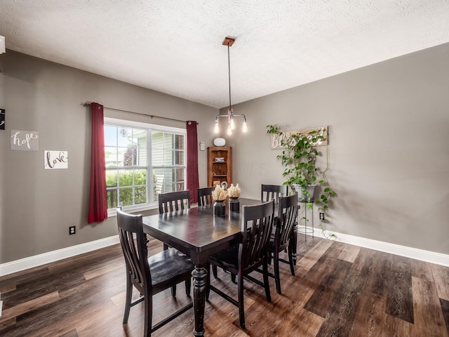 9148 Mccord Rd, Orient, OH 43146 - dining room featuring dark wood-style floors, baseboards, and a textured ceiling