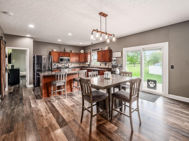 9148 Mccord Rd, Orient, OH 43146 - dining room featuring a textured ceiling, dark wood-type flooring, recessed lighting, and baseboards