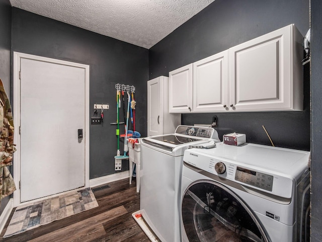 9148 Mccord Rd, Orient, OH 43146 - laundry room with cabinet space, separate washer and dryer, dark wood finished floors, baseboards, and a textured ceiling
