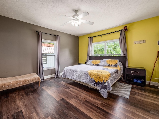 9148 Mccord Rd, Orient, OH 43146 - bedroom with multiple windows, baseboards, wood finished floors, and a textured ceiling