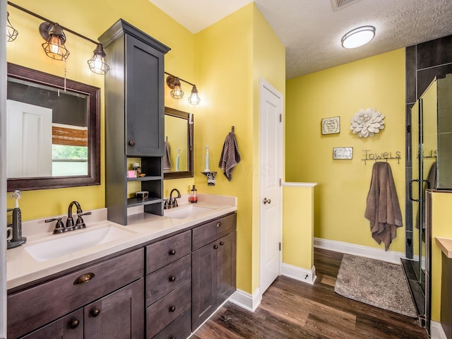 9148 Mccord Rd, Orient, OH 43146 - bathroom with double vanity, wood finished floors, and baseboards