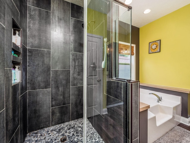 9148 Mccord Rd, Orient, OH 43146 - bathroom featuring a stall shower and a garden tub
