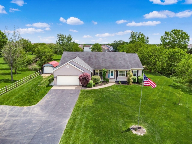 9148 Mccord Rd, Orient, OH 43146 - ranch-style house with driveway, a garage, an outbuilding, and a shingled roof