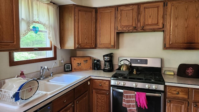 14780 Bellepoint Rd, Ostrander, OH 43061 - kitchen with stainless steel gas range oven and brown cabinets