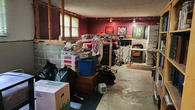 14780 Bellepoint Rd, Ostrander, OH 43061 - miscellaneous room with concrete flooring and a textured ceiling