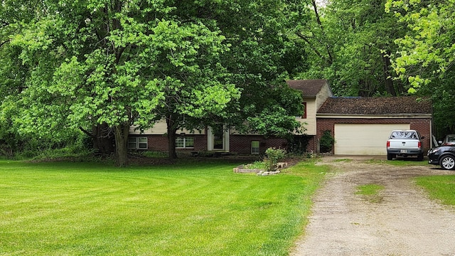 14780 Bellepoint Rd, Ostrander, OH 43061 - tri-level home with dirt driveway, a front lawn, a garage, and brick siding