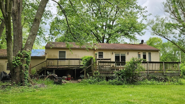 14780 Bellepoint Rd, Ostrander, OH 43061 - rear view of house with a wooden deck, a yard, and a chimney