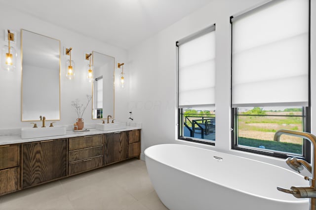 3318 S County Line Rd, Johnstown, OH 43031 - full bath with a soaking tub, double vanity, healthy amount of natural light, and tile patterned flooring