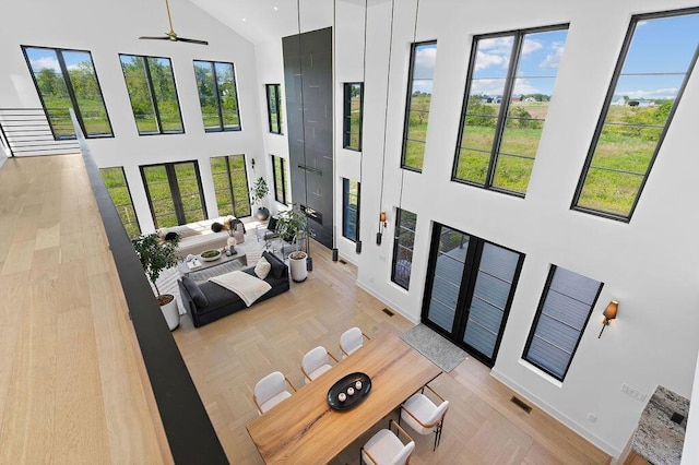 3318 S County Line Rd, Johnstown, OH 43031 - living area featuring high vaulted ceiling, a ceiling fan, and baseboards