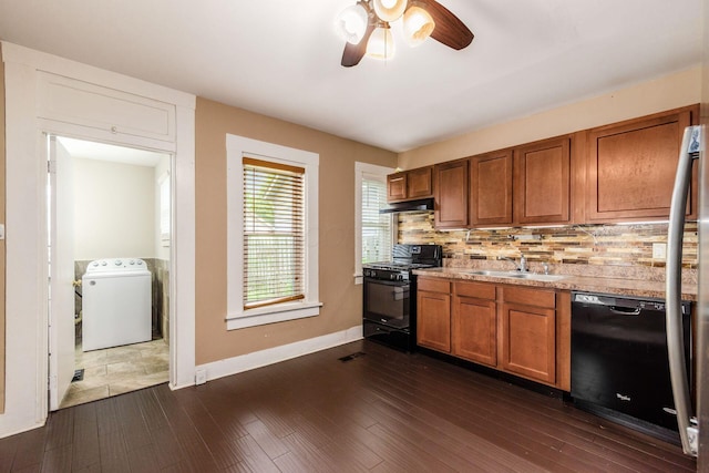 815 Hamlet St, Columbus, OH 43215 - kitchen featuring washer / clothes dryer, black appliances, a sink, brown cabinets, and ceiling fan