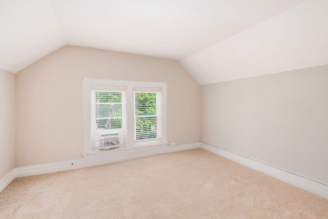 815 Hamlet St, Columbus, OH 43215 - additional living space featuring lofted ceiling and light colored carpet
