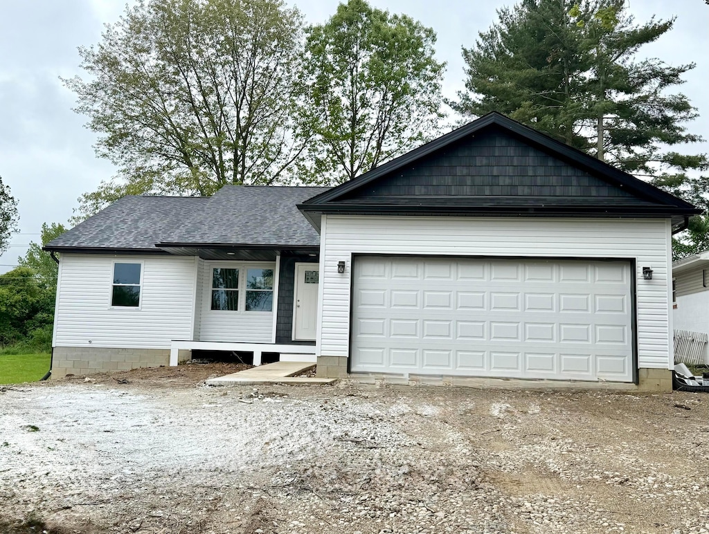 129 Hasbrouck Cir, Howard, OH 43028 - view of front facade featuring a garage and driveway