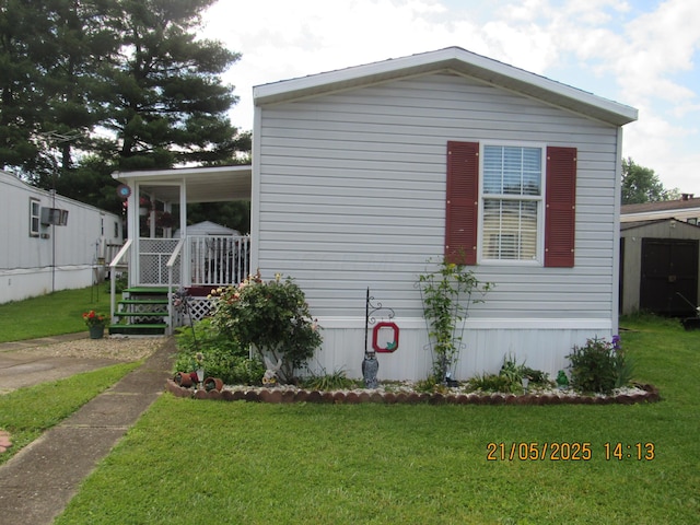 235 Parklawn Dr, Circleville, OH 43113 - view of property exterior featuring a lawn and covered porch