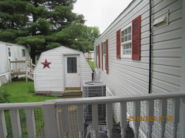 235 Parklawn Dr, Circleville, OH 43113 - deck with cooling unit and a yard