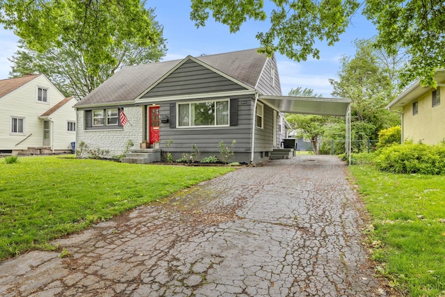 1296 Bryson Rd, Columbus, OH 43224 - bungalow-style house with driveway and a carport