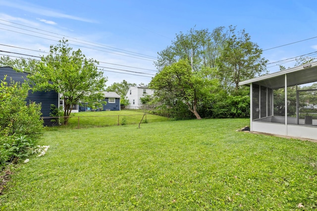 1296 Bryson Rd, Columbus, OH 43224 - view of yard with a sunroom